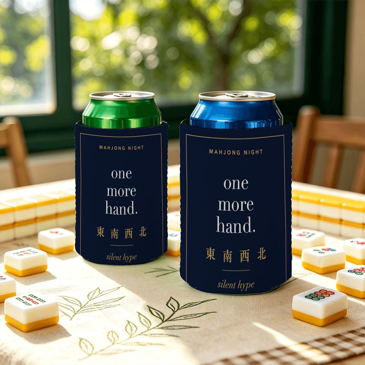 Two one more hand stubby holders on a mahjong table with tiles