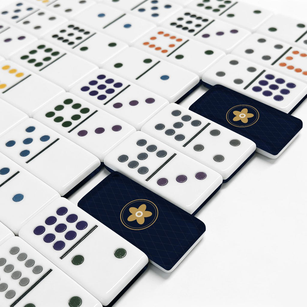 Close-up of engraved domino pips and navy backs